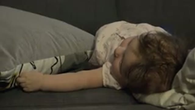 WESTMINSTER COLORADO-2015: An Infant With Brown Hair Lying On A Couch Being