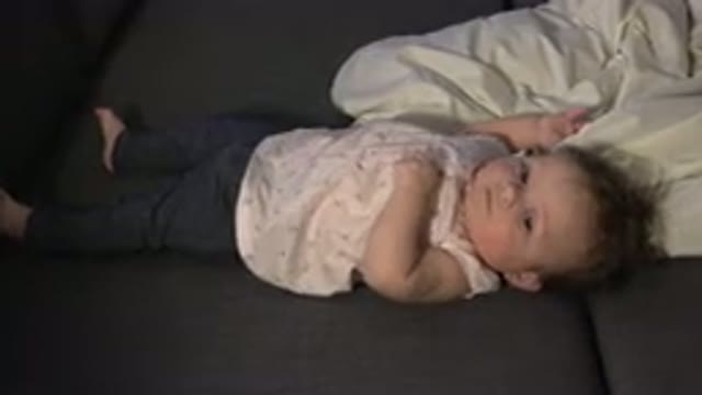 WESTMINSTER COLORADO-2015: Baby Dressed in a White T-Shirt and Black Pants Lying on Sofa