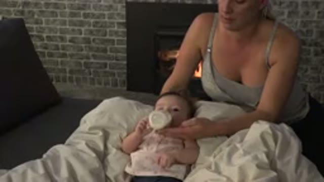 WESTMINSTER COLORADO-2015: Nurturing Mother Feeding Baby Milk From a Bottle