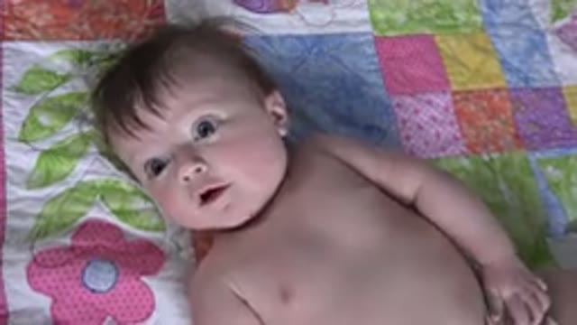 WESTMINSTER COLORADO-2015: Little Girl Laying On A Bed Staring Up At The Camera