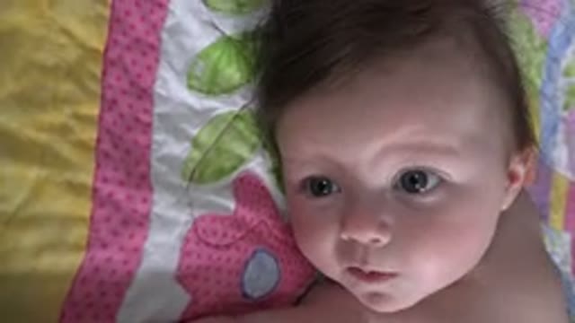 WESTMINSTER COLORADO-2015: Baby Boy With Green Eyes And Pale Skin Showing Tongue