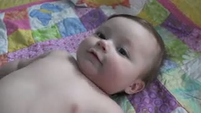 WESTMINSTER COLORADO-2015: A Baby Lying And Babbling On A Colorful Quilt
