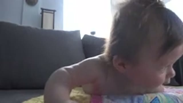 WESTMINSTER COLORADO-2015: An Infant Laying Belly Down On A Blanket Lifts Their Head