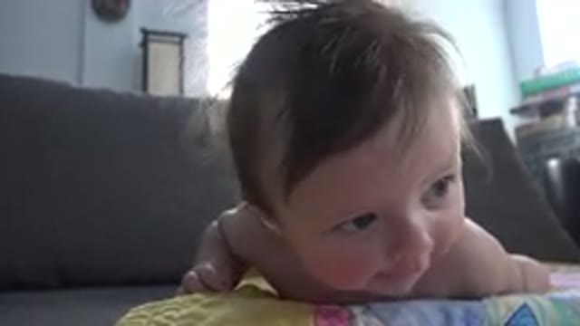 WESTMINSTER COLORADO-2015: A Baby Lifting Herself Up Off Of Her Toy Mat On The Floor