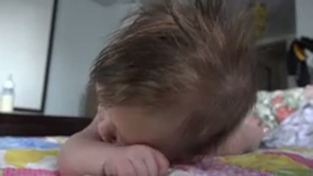 WESTMINSTER COLORADO-2015: Baby With Blue Eyes Looks Around And Rises In Bed