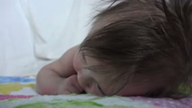WESTMINSTER COLORADO-2015: Infant Lying Quietly On Stomach With Fabric Movement