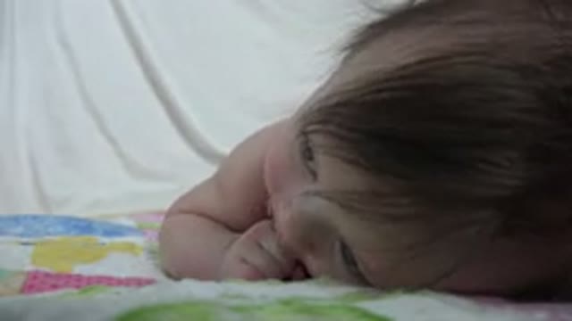 WESTMINSTER COLORADO-2015: Adorable Cute Baby Lying in the Bed