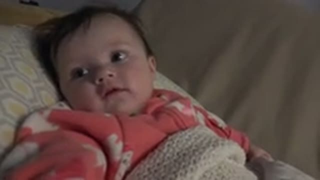 WESTMINSTER COLORADO-2015: Baby Lying On The Bed Looking At The Person
