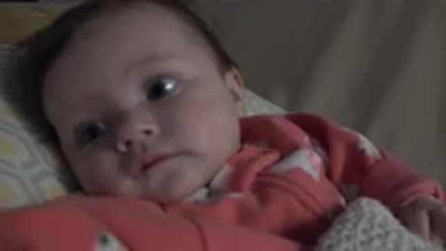 WESTMINSTER COLORADO-2015: Baby Lies Down While Playing With Parent In Crib