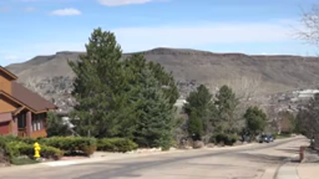 WESTMINSTER COLORADO-2015: Wood Panel Home At The Base Of A Mountain With Green