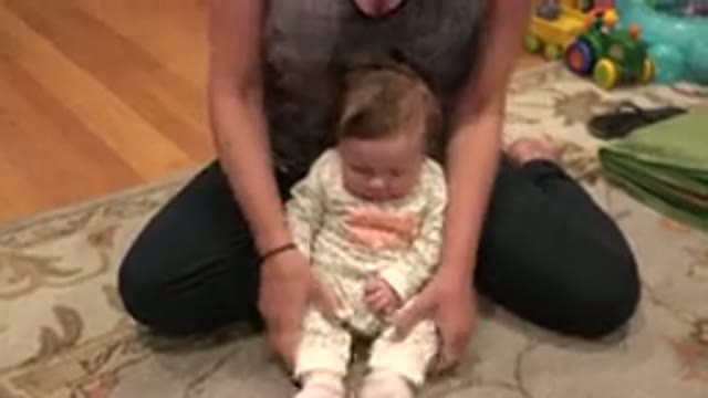 WESTMINSTER COLORADO-2015: Mother Sitting On Carpet With Baby