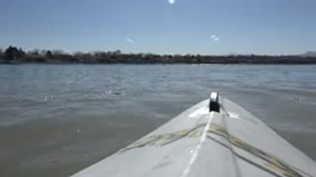 HIDDEN LAKE COLORADO-2015: A Boat Sailing in the Middle of a Pond Surrounded by Trees