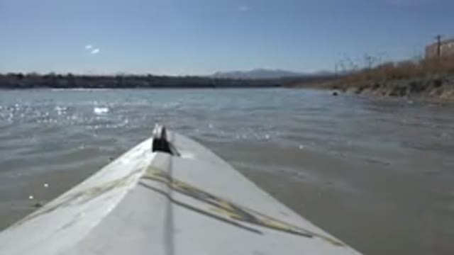 HIDDEN LAKE COLORADO-2015: White Object Floats On A Murky Lake On A Sunny Day