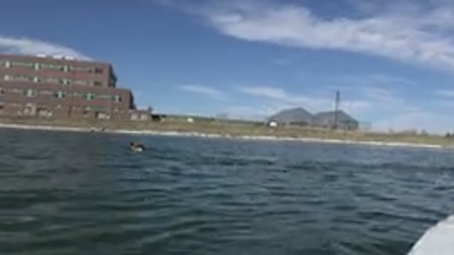 HIDDEN LAKE COLORADO-2015: A Four Story Waterfront Building With Mountains In