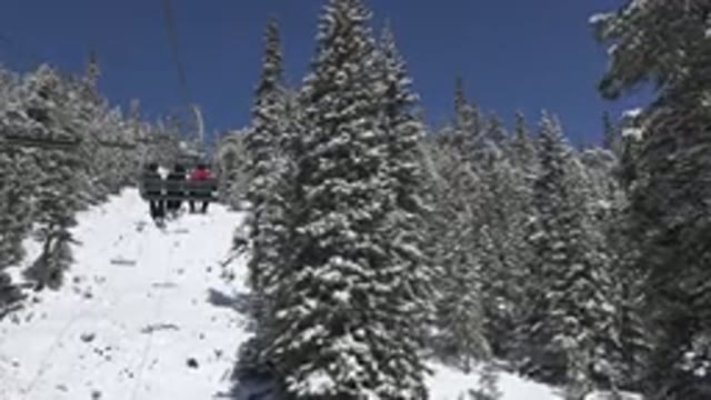 KEYSTONE COLORADO-2015: People Riding Chair Lift on Snowy Mountain Ski Resort