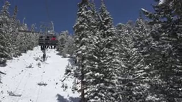 KEYSTONE COLORADO-2015: Ski Lift Rising on Snowy Mountain with Skiers