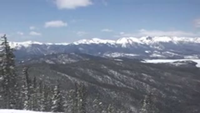 KEYSTONE COLORADO-2015: Landscape With Trees And Snow-Capped Mountains On The Horizon