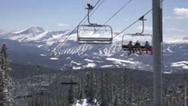 KEYSTONE COLORADO-2015: People Climbing Mountain by Cable Car to Snowboard