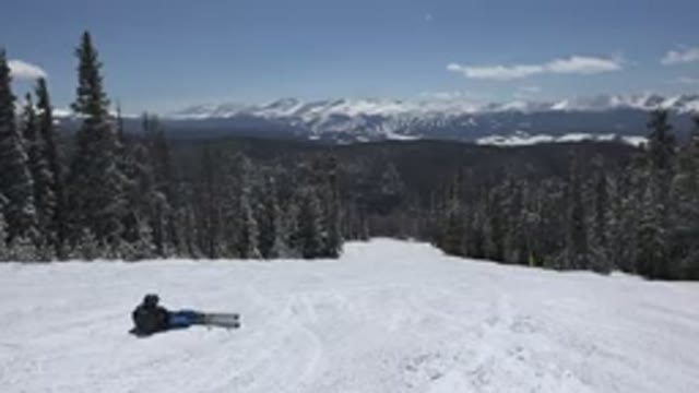 KEYSTONE COLORADO-2015: Man Enjoying Skiing With Trees Around