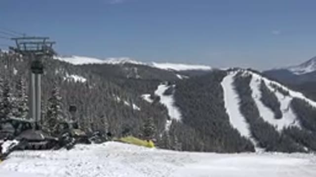KEYSTONE COLORADO-2015: A Ski Lift in Motion Against a Snow-Covered Mountain