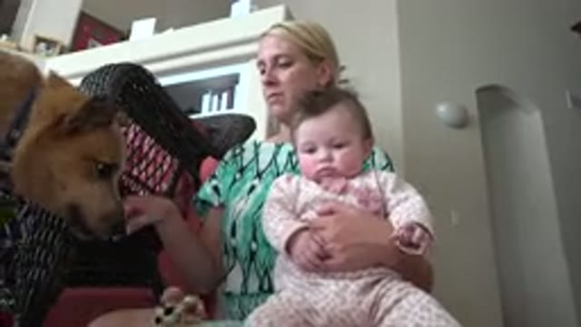 WESTMINSTER COLORADO-2015: A Woman Carrying Her Baby in Her Arms