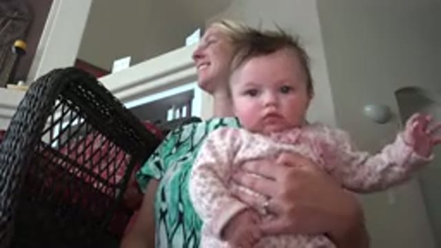 WESTMINSTER COLORADO-2015: Blonde Woman With A Baby Sitting And Playing On Her Lap