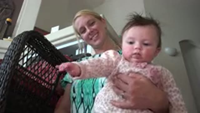 WESTMINSTER COLORADO-2015: Woman Sitting On Floor Holding Her Daughter