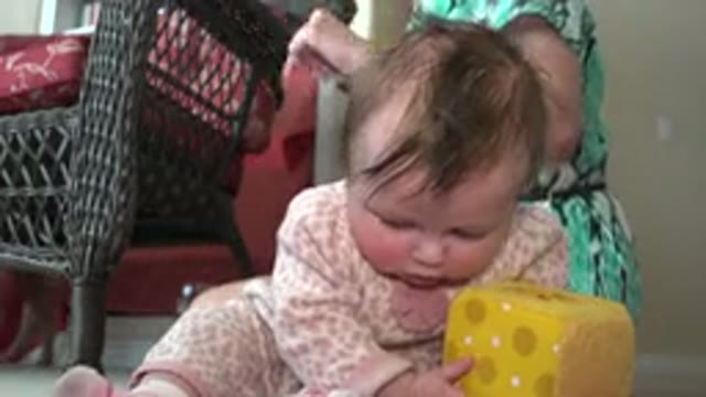 WESTMINSTER COLORADO-2015: Frustrated Toddler Teething While Playing With Toy