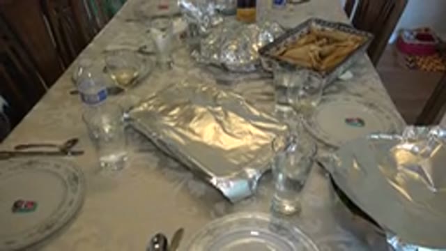WESTMINSTER COLORADO-2015: Foil Covered Food Dishes Arranged On White Dining Table