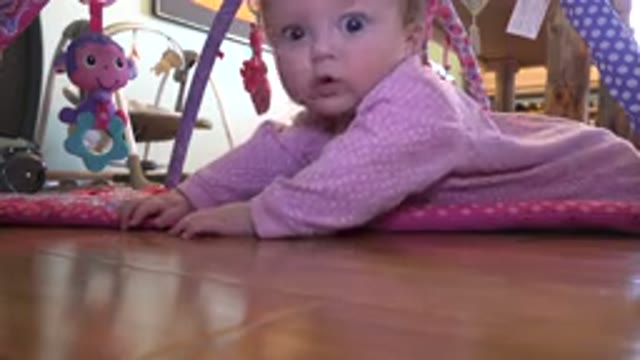 WESTMINSTER COLORADO-2015: Baby Girl Making Funny Faces During Tummy Time