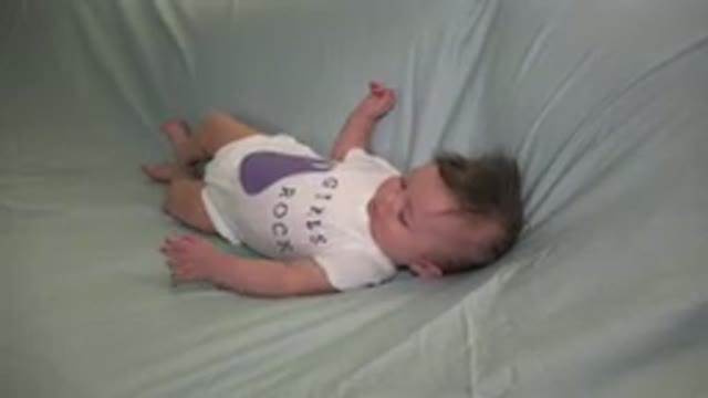 WESTMINSTER COLORADO-2015: Baby On A Couch Is Picked Up By An Adult Person