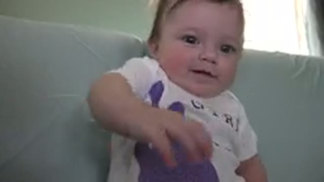 WESTMINSTER COLORADO-2015: Baby Sitting On The Sofa Raising His Arm Trying To