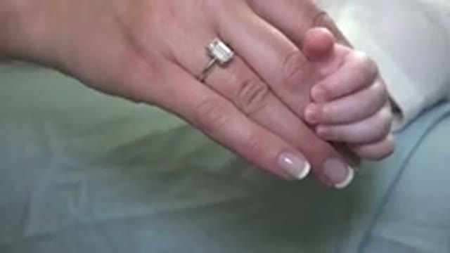 WESTMINSTER COLORADO-2015: A Large Diamond Ring With A Gold Band On The Hand Of