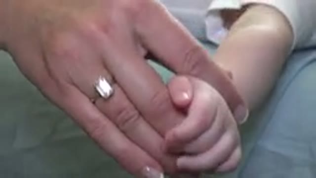 WESTMINSTER COLORADO-2015: A Woman Or A Nurse Working On A Patient Child Who Is
