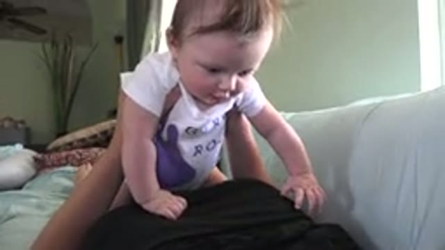 WESTMINSTER COLORADO-2015: Person Wearing Black Shirt Holds Baby Wearing White