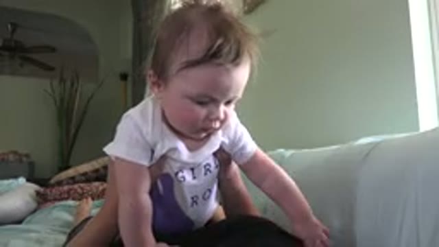 WESTMINSTER COLORADO-2015: Woman Wearing Black Shirt Holds Baby Wearing White