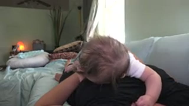 WESTMINSTER COLORADO-2015: Adorable Baby With His Mother On The Couch