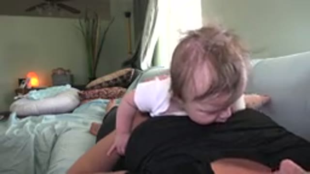 WESTMINSTER COLORADO-2015: Mom And Baby Laying On A Sofa In A Room