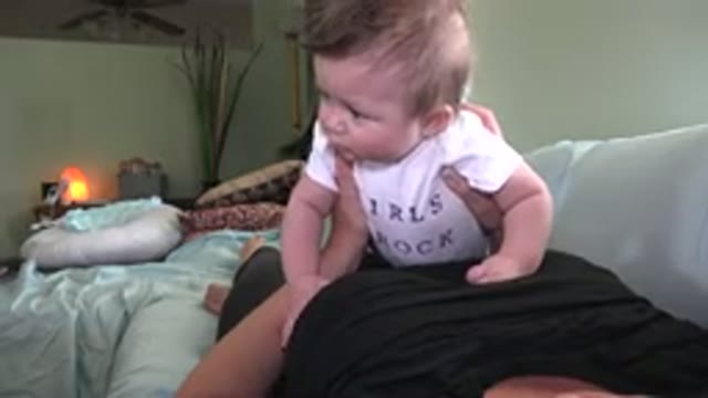 WESTMINSTER COLORADO-2015: Baby Lying On His Mother On The Couch Trying To Suckle