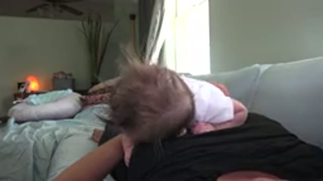 WESTMINSTER COLORADO-2015: A Baby On Top Of His Mother While She Hits Him Playfully