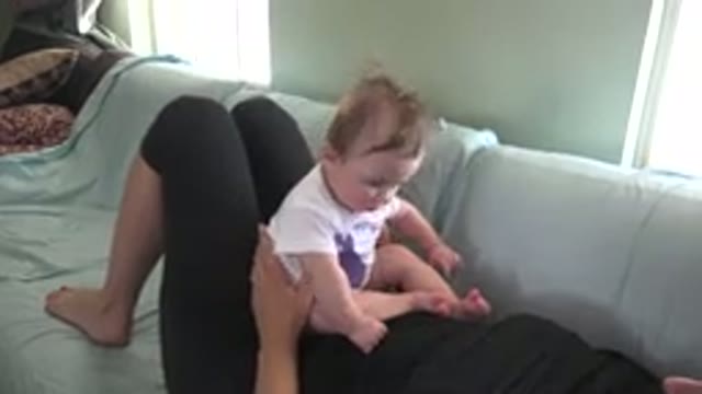 WESTMINSTER COLORADO-2015: Person Wearing Black Pants And Shirt Lies On Green Sofa