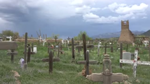 TAOS NEW MEXICO-2015: Rainy Day Over The Christian Cemetery Field With Green
