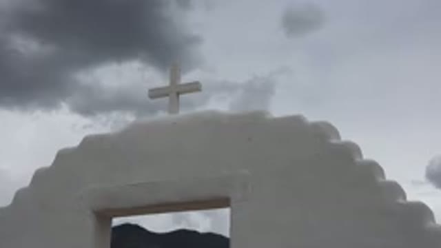 TAOS NEW MEXICO-2015: A Cross Standing Tall Underneath the Clouds and Sky