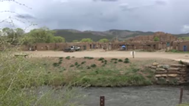TAOS NEW MEXICO-2015: Outdoor Building With Mountain In Background With Running