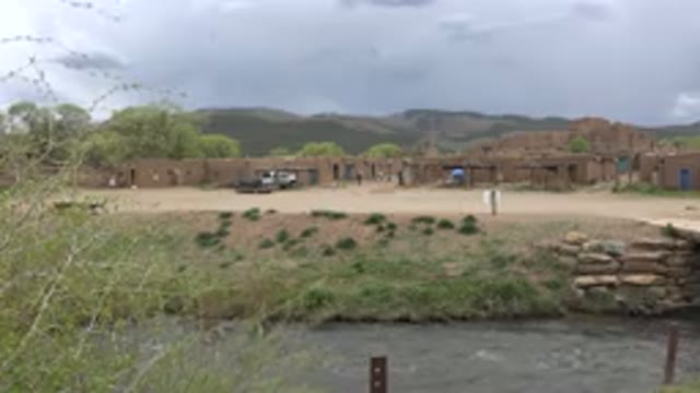 TAOS NEW MEXICO-2015: Houses And A Road In Front Of A River With Water
