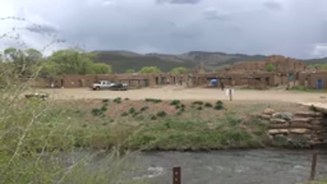 TAOS NEW MEXICO-2015: River In Isolated Area Of The City With People Cars