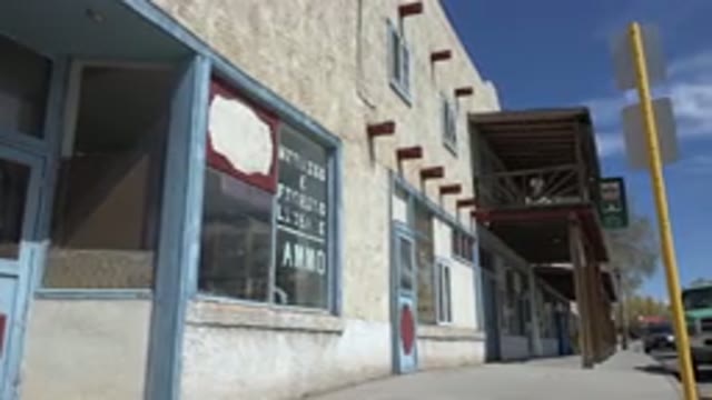 TAOS NEW MEXICO-2015: A Deserted Veranda Of A Shopping Complex Beside A Street