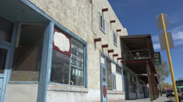 TAOS NEW MEXICO-2015: A Building With A Blue Outline Around The Windows On A