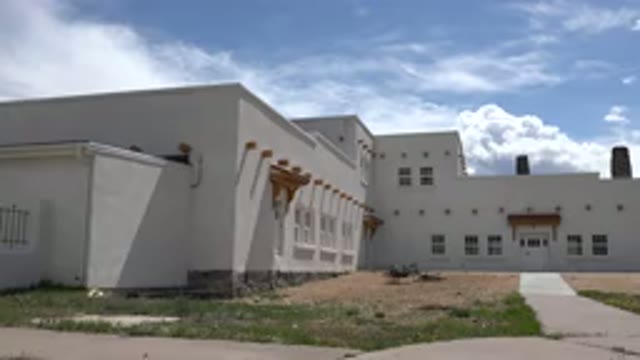 TAOS NEW MEXICO-2015: Modern White Building Exterior View on Sunny Day Near Sidewalk