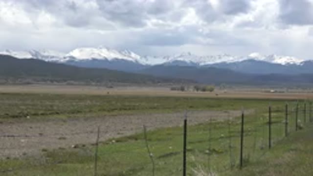 TAOS NEW MEXICO-2015: Panoramic Open Area With Grass And Several Mountain Ranges